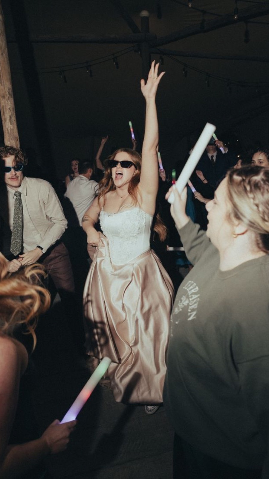 Guests dancing at the party after dark.