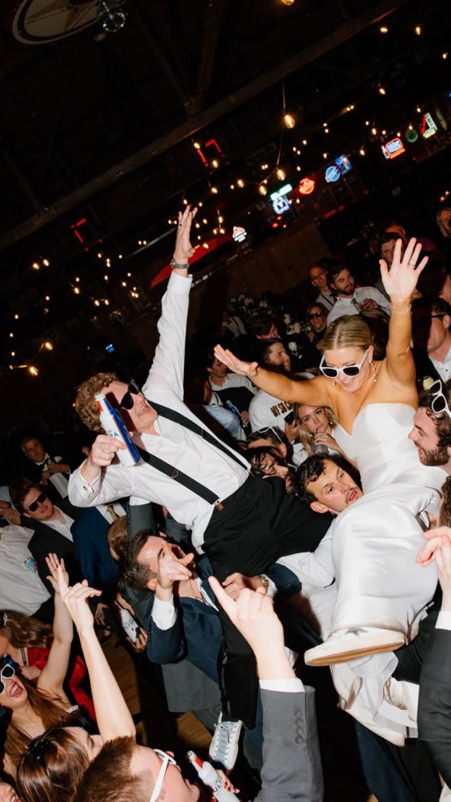 A guest lifted into the air on the dance floor.